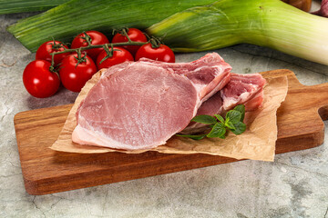Raw pork steak loin with bone