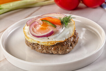 Beefsteak chop with roasted egg