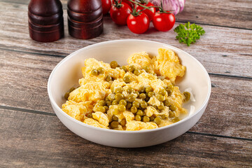Scrambled egg omelet with green peas