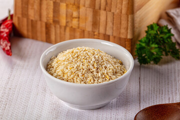 Raw dry sesame seeds heap