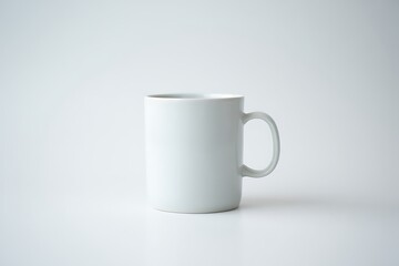 Fototapeta premium Simple Ceramic White Mug on a Clean White Background for Minimalist Design and Lifestyle Photography