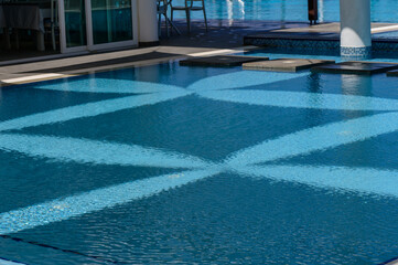 Reflection of Sunshade Canopy on Pool Water