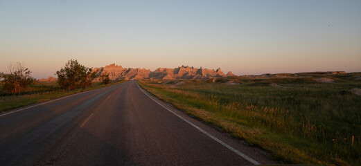 Badlands rock formations at sunset