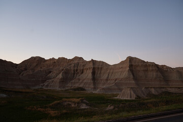 Sharp peaks and rounded hills in Badlands during dusk