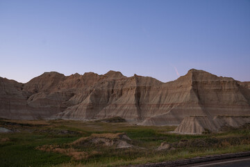 Sharp peaks and rounded hills in Badlands during dusk