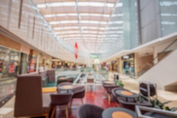 Blurry interior of a shopping mall with a bokeh background.