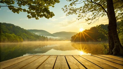 Serene lakeside sunrise view from wooden dock with reflections on calm water and misty mountain landscape