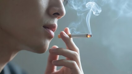 Obraz premium A person holds a lit cigarette, with smoke curling, presenting a close - up of the smoking moment, conveying a unique life situation and emotion.