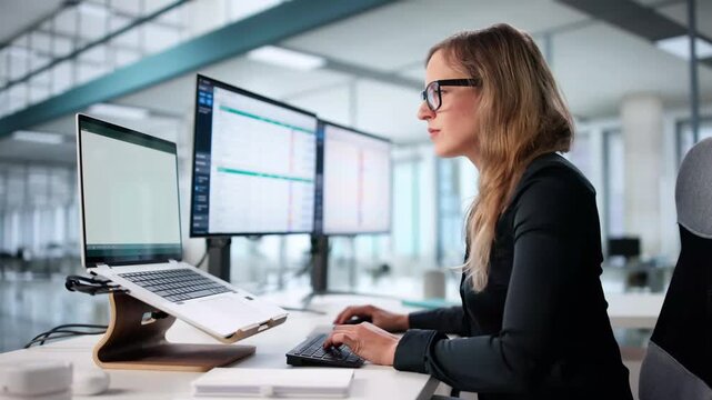 Analyzing Billing Codes On Spreadsheets, A Woman Works Diligently
