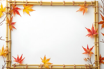 A rectangular bamboo frame is decorated with colorful red and yellow autumn maple leaves, creating a border on a white background.