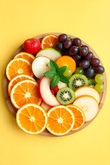 Colorful Fresh Fruit Platter with Oranges, Apples, Grapes, and Kiwi