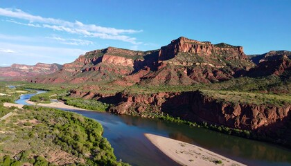 High-angle view of a river winding through red rock canyons