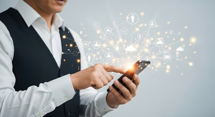 Businessman using smartphone technology for communication with bright digital icons