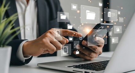 Digital technology concept showing a man using a smartphone for cloud data management tasks
