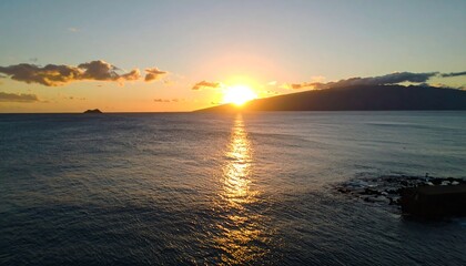 Golden sunset over calm ocean