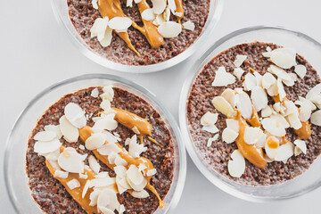 cocoa chia pudding with almond flakes and peanut butter