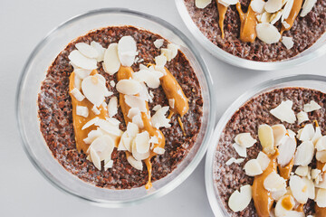 cocoa chia pudding with almond flakes and peanut butter