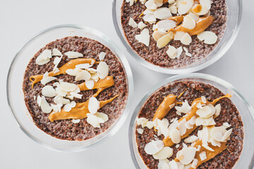 cocoa chia pudding with almond flakes and peanut butter