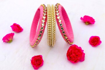 red and gold bracelet isolated on white. red and gold bracelet. background. red background. black and blue bracelet. pink bracelet.