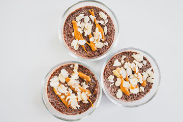 cocoa chia pudding with almond flakes and peanut butter
