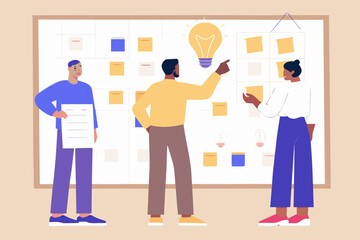 Team collaborating on a project using a whiteboard and sticky notes