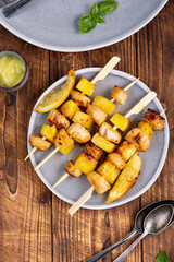Fried scallops with pineapple on plate.