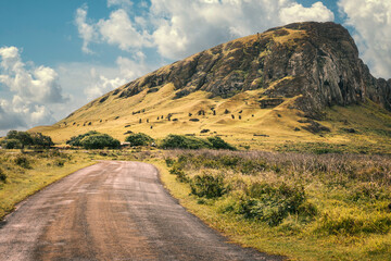 View of quarries and moai on the southwest face of the Rano Raraku volcano, Rapa Nui (Easter Island), Chile. This extraordinary site is where the 1,000 moai statues found on the island were sculpted.