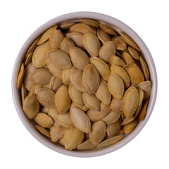 Pumpkin seeds in a round plate isolated on white background, top view