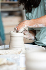 hands of a potter at work