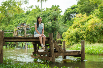woman resting on edge of wooden jetty