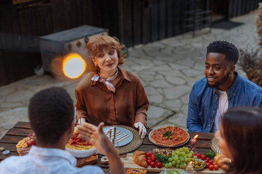 Conversation over a dinner outdoors - Powered by Adobe