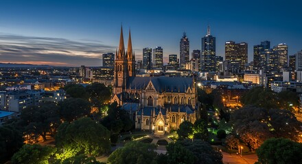 Obraz premium A mesmerizing glimpse of melbourne, au - oct 12, 2024: stunning aerial night view of st patrick's cathedral in melbourne, australia, illuminated against the city skyline.