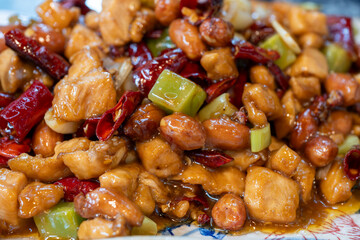 Delicious kung pao chicken served with peanuts and chilies in Du