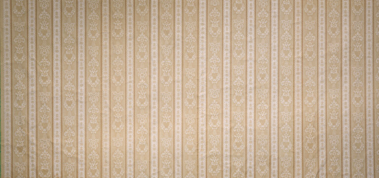 Old wallpaper on the wall. Old wallpaper for texture or background.