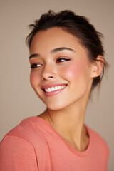 smiling model with coral blush and natural eyebrows soft beauty portrait