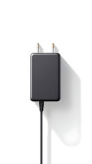 A close up view of a black charger with a cord on a white background with its shadow visible