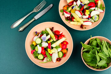Fresh mixed salad with edible flowers.
