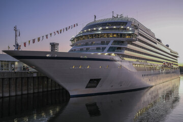 Naklejka premium All inclusive luxury yacht cruiseship cruise ship liner Star docked in port St. Lawrence River in Montreal, Quebec Canada during New England Indian Summer cruising