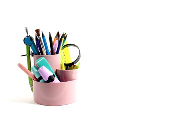 An organizer with school stationery stands on a white background.