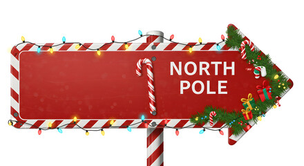 North Pole candy cane arrow sign decorated with garland and presents isolated on white background. Christmas template of red road and transportation sign with copy space for your art