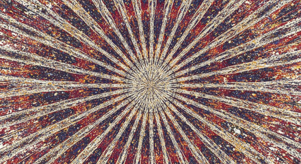 A radial burst of dark orange lines emanating from a central point. The background has texture and a weathered appearance.

