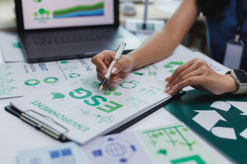 Manager analyzing esg environmental social and corporate governance key performance indicators