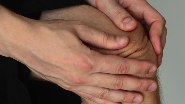 sick male knee.
Asian guy has a bruised kneecap.
Asian man has a sprained knee and massages his knee.
Pain and discomfort in the leg