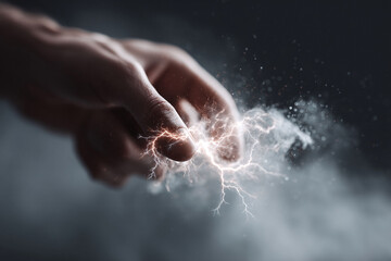 Fototapeta premium Hand generating power. Lightning emanates from fingertips. Conceptual image for energy, strength, innovation, technology. Great for science, business, and creative projects.