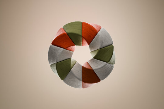 Abstract 3D torus sculpture of geometric stone shapes on neutral background