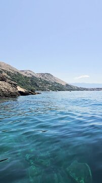 Campsite at Campig Skrila, Krk Island, Stara Baska Croatia,  View of the Mountains and Coast With Boats, Beaches and Adriatic Sea. The Seaside Rv Campmobiles on a Summer Beautiful Coastline