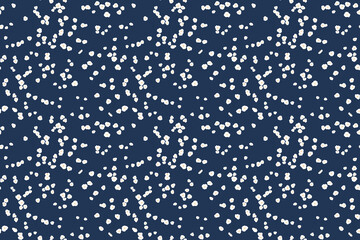 Seamless pattern of tiny white floral dots, small spots, little drops scattered across a navy background. This playful, minimalist design  for print, textiles, gift wrap, wallpapers, stationery