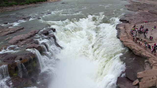 	
Drone view of Hukou Waterfall in Shanxi Province, China, it is a magnificent sight of the surging Yellow River water, filled with energy and awe inspiring，4k slow motion footage aerial view