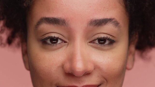 Close-up of woman raising eyebrows in hint gesture