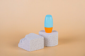 Cosmetic product in tube, bottle, lotion or serum with stylish props on cream background. 